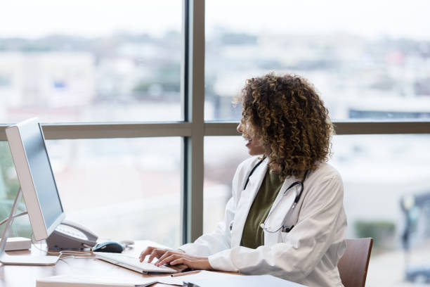istock Young adult female doctor using computer 1206365676