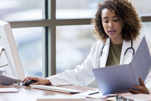 istock Doctor reviews patient's test results 1206365680