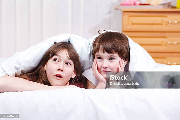 Surprised Children Stock Photo - Download Image Now - Beautiful People, Beauty, Bed - Furniture