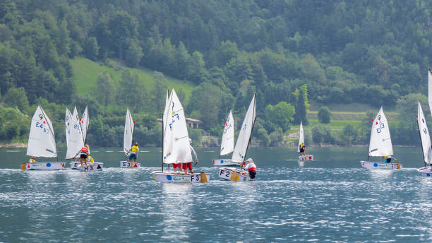 Ledro, Italy. Sailing school on small boats. School on Lake Ledro. Alpine lake. Summer time stock photo