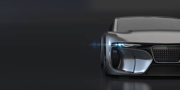 Metallic black electric powered sports coupe on black background with copy space