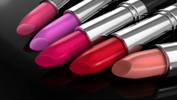 istock Pink and red lipsticks in black and silver metallic glossy container. 1206375134