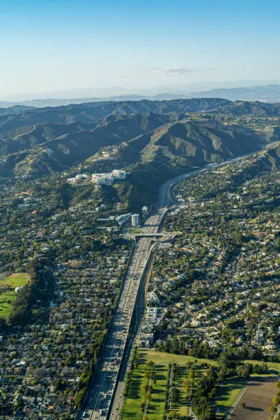 Aerial view above 405 Freeway in Los Angeles looking North towards Bel Air, Brentwood, Westwood Santa Monica