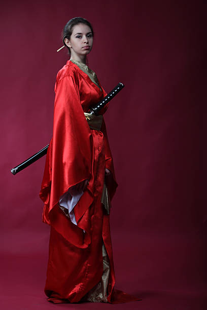 istock Girl in the kimono with a katana 120637587