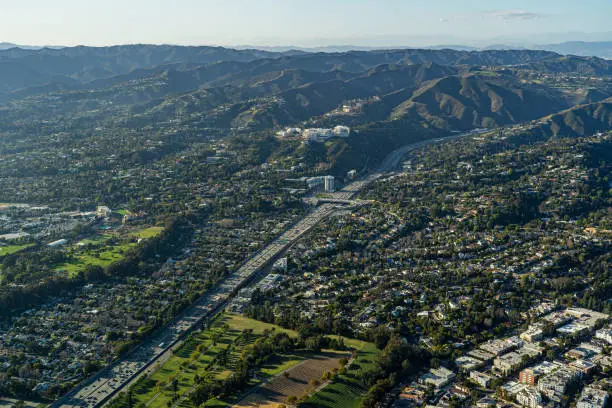 Aerial view above 405 Freeway in Los Angeles looking North towards and Bel Air, Brentwood, Westwood Santa Monica