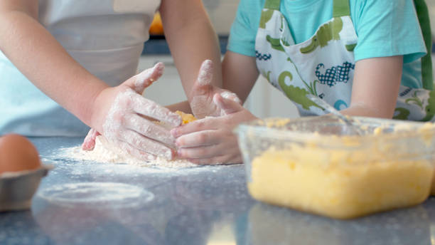 istock Two children cooking together 1206379063