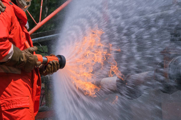 istock Gas leak from pipe and valv.flame from gas leak.fire fighting with extingguishers and fire hose.fighters in action at gas Fire 1206381375