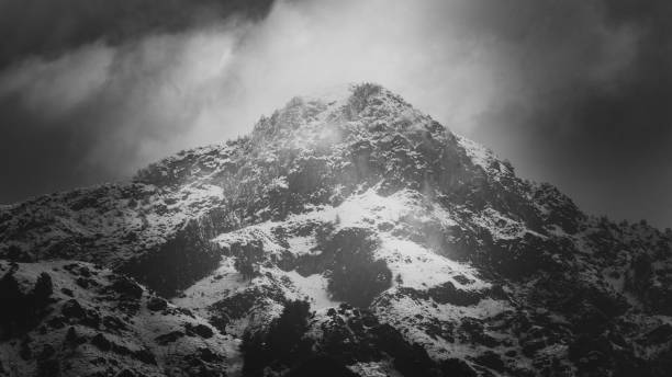 istock Amazing light passing through clouds and falling on the snow clad Zabarwan Mountain Range in Srinagar 1206382663