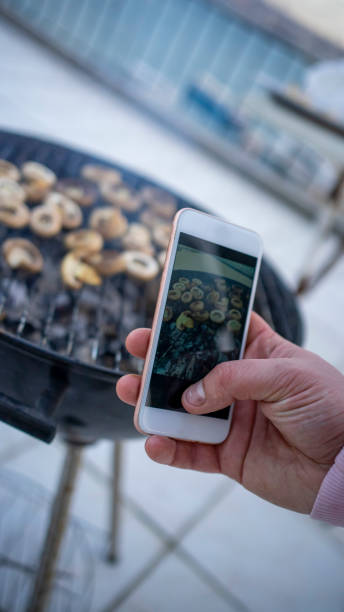 istock man taking a barbecue photo 1206385039