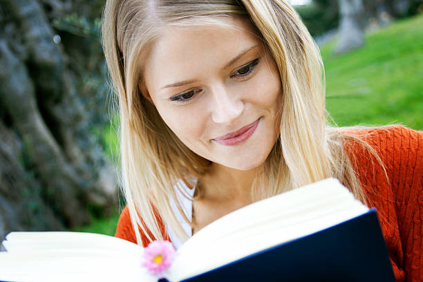 istock young student with books in the park 120638895