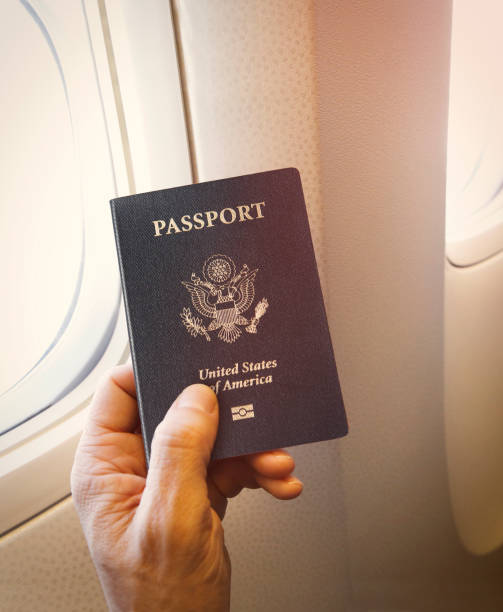 istock Passenger with american passport on the plane 1206389372
