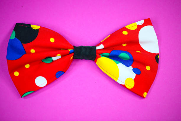 istock colorful bow tie for carnival, pink background 1206390283