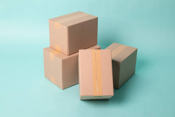 istock Pile of four taped up  cardboard boxes 1206390384