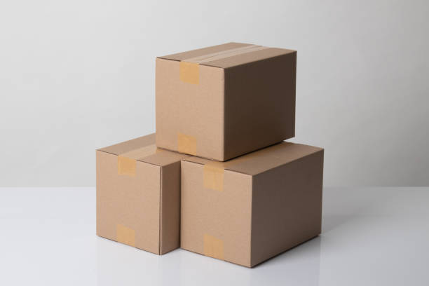 istock Pile of three  taped up  cardboard boxes 1206390409
