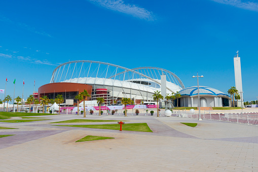 Doha, Qatar - November 24, 2019 : Entrance of Khalifa National Stadium against blue sky in Doha, Qatar on November 24, 2019.
