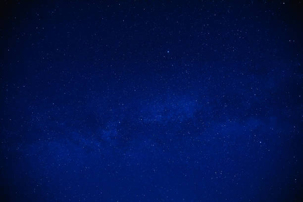 istock Milky way stars on a dark night sky. 1206390527