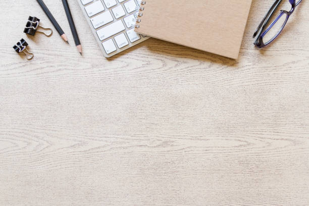 istock top view wooden office desk with computer and supplies 1206393791