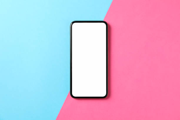 istock Phone with empty screen on two tone background, top view 1206395127