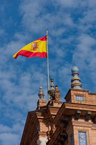 istock (Seville, Spain). Spanish Steps - Spanish Flag flying over the central tower 1206395705