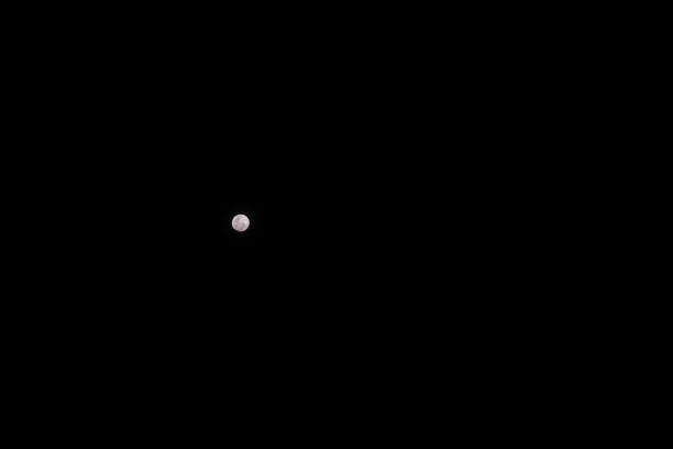 istock Full moon against a black night sky. Night scene. 1206396338
