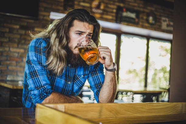 istock A man enjoying a beer at a bar 1206396354