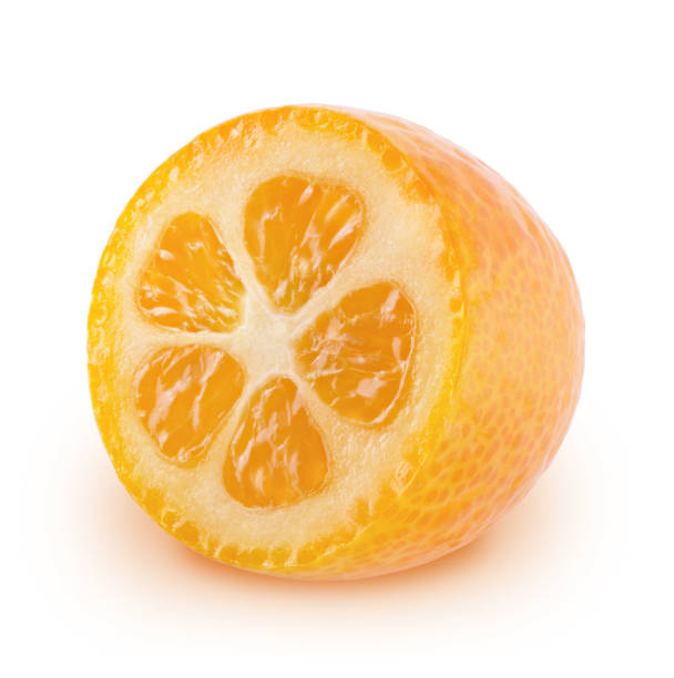 istock Half of kumquat isolated on white background. 1206396502