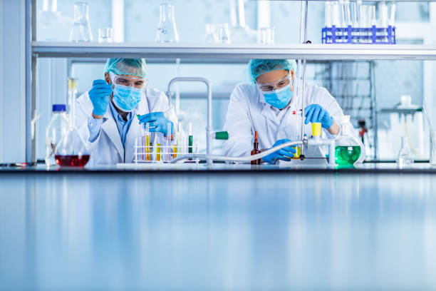 istock Male scientists working on chemical substances in laboratory. 1206396715