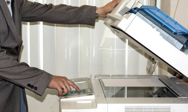 istock Businessman working with printer in the office 1206397787