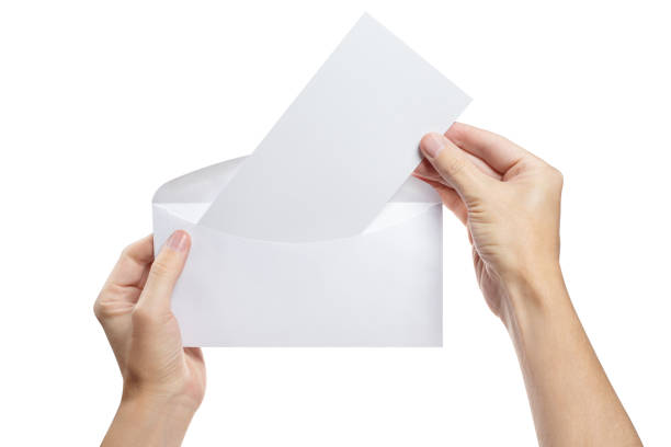 白い封筒から白い紙を取り出す手 - stationary sheet template paper ストックフォトと画像