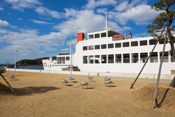 Naoshima, Japan-02 20 2015:Ferry at Miyamoura port on the island of Naoshima, Japan. Naoshima is an island town administratively part of Kagawa District, located in the Seto Inland Sea.The administrative town is made up of 27 islands, of which Naoshima Island is the largest.Naoshima Island is known for its many contemporary art museums.