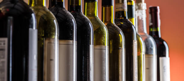 istock Line of wine bottles. Close-up. 1206401494