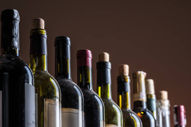 Line of wine bottles. Close-up.