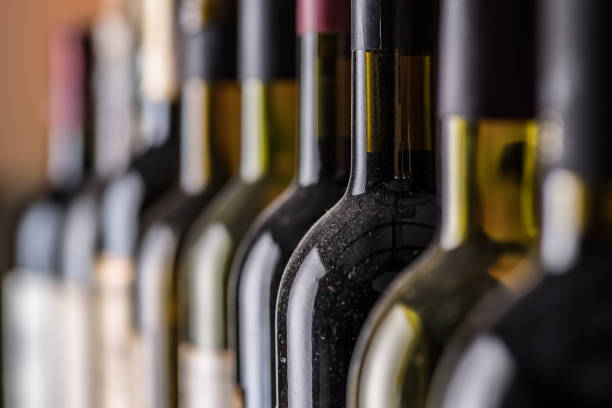 istock Line of wine bottles. Close-up. 1206403059