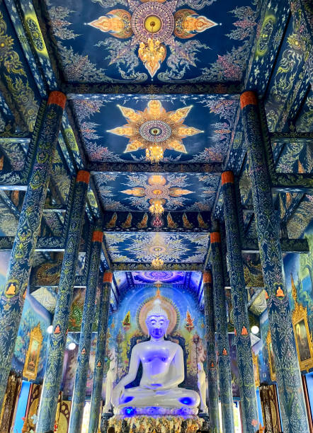 istock white Buddha statue at unique Blue Temple (Wat Rong Suea Ten). 1206403931