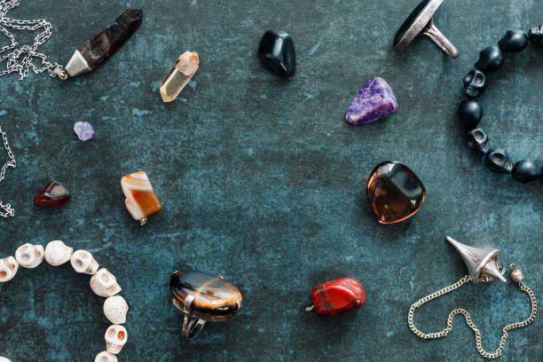 istock Magic flat lay. Various precious and semiprecious stones on a blue background for witchcraft. 1206403988
