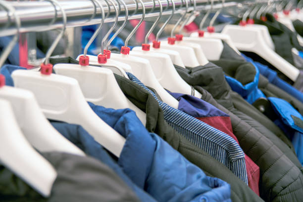 istock Clothes on hangers in the store 1206405214