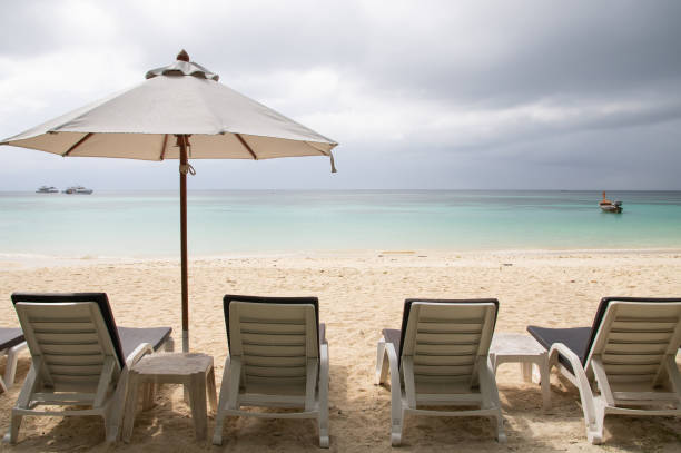 istock Beautiful beach with umbrella on the beach 1206405743