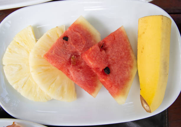 istock Fresh fruits on white plate 1206405760