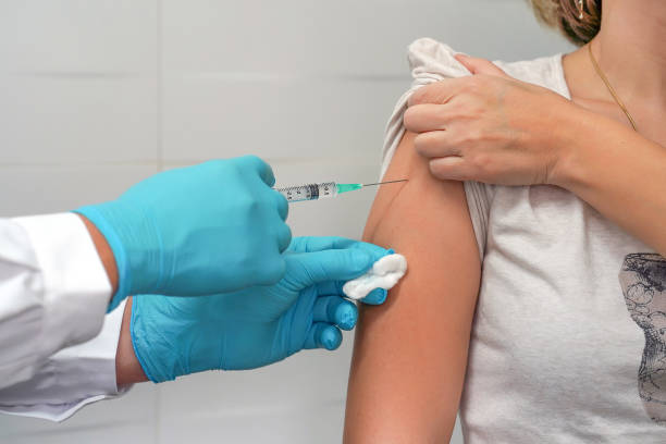 istock Woman gets vaccinated against flu, flu shot, HPV prevention 1206405930
