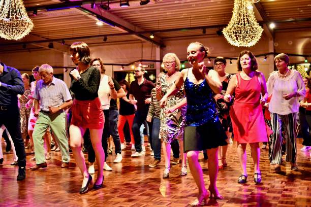 Workshop classes. Indoor line dancing by a professional instructor. Herent, Belgium - September 14, 2019: Open House indoor dancing classes evening show. Photo reportage open door promotion indoor dance classes. Courses starting half September. Teacher in front of group demonstrates solo dance. teacher retirement party stock pictures, royalty-free photos & images