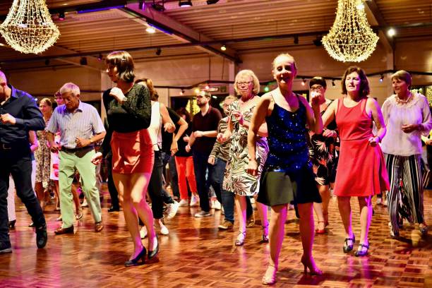 Workshop classes. Indoor line dancing by a professional instructor. Herent, Belgium - September 14, 2019: Open House indoor dancing classes evening show. Photo reportage open door promotion indoor dance classes. Courses starting half September. Teacher in front of group demonstrates solo dance. teacher retirement party stock pictures, royalty-free photos & images