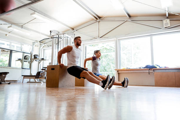 istock Friends working out at the gym 1206411313