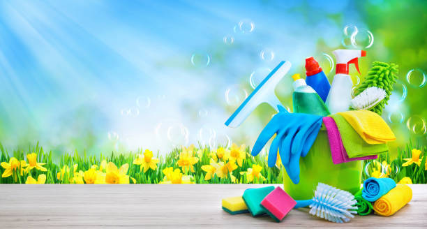 istock Bucket with cleaning items with sun beams and soapbubbles 1206411337
