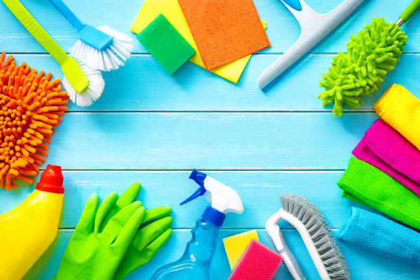 istock Colorfull cleaning items on blue wooden 1206411350