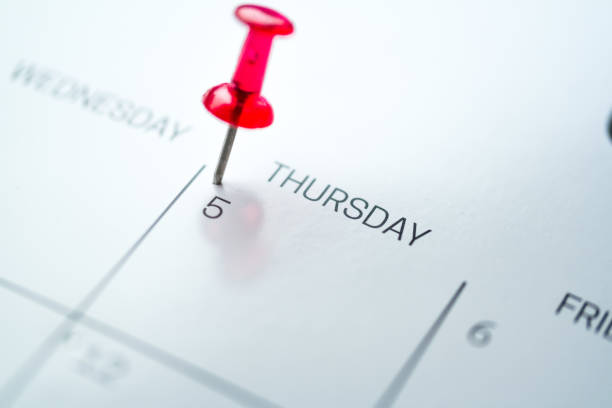 istock Red push pin on calendar 1206411760