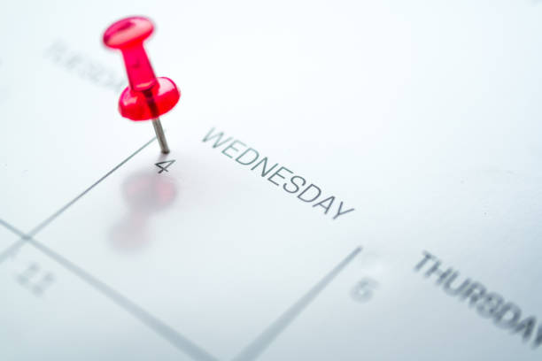 istock Red push pin on calendar 1206411810