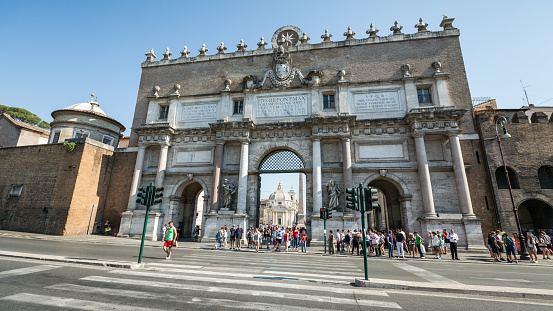 July 19th 2014, Rome, Italy: A crowd of tourists waiting for a green traffic light out of Piazza del Popolo, during a warm summer day