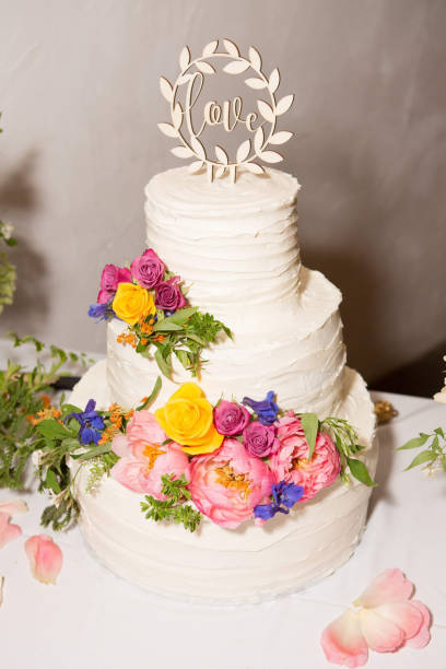istock White wedding cake with flowers 1206415485
