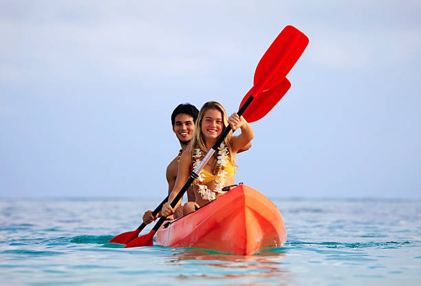 istock young couple with their kayak 120641576