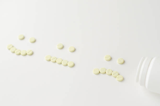 istock Pills spilling out of pill bottle 1206416148